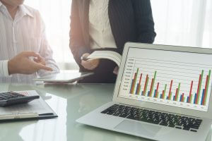 The report summarizes the result of business operation on computer screen and business people meeting.