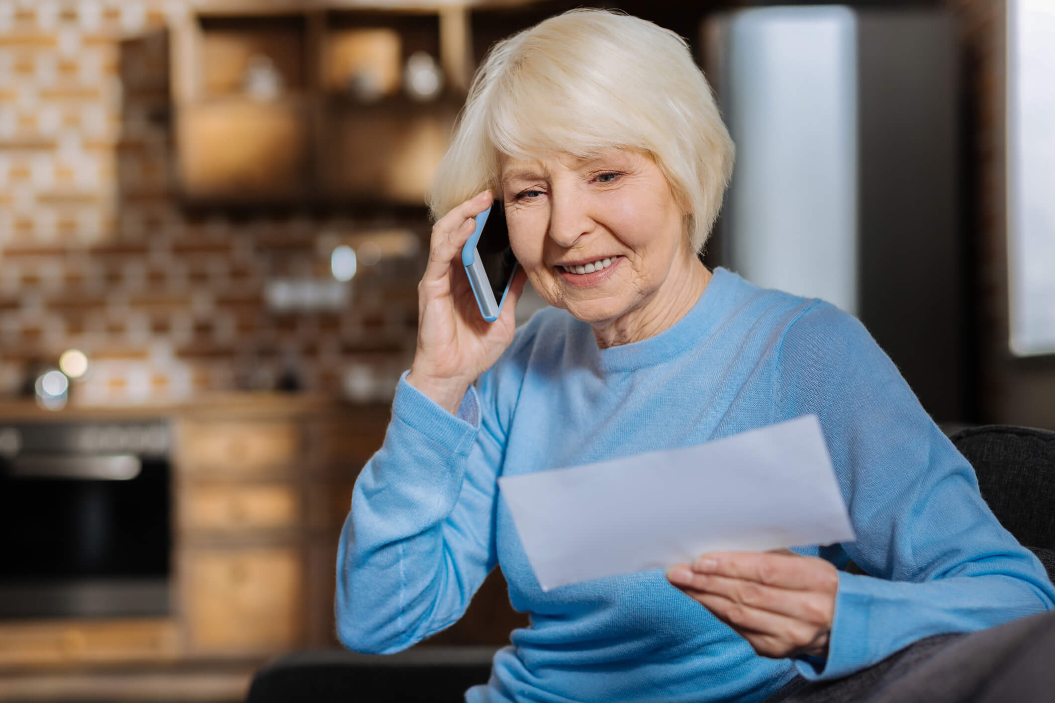 Delighted elderly woman making a phone call Complete Controller